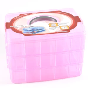 a large pink box with various compartments to hold sewing equipment 