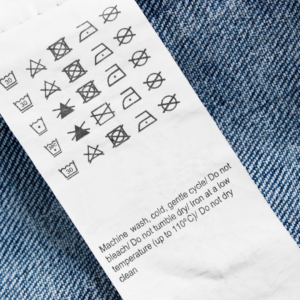 care label for clothing with logos and explanations as to how to take care of the garment